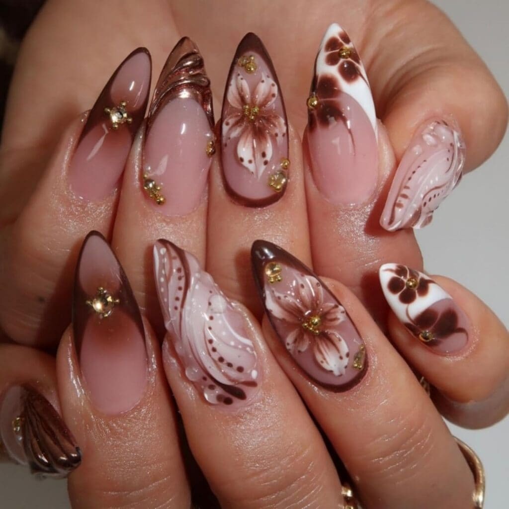 Brown French tip press on nails with 5D floral design, rhinestones, and glossy finish in medium almond shape for fall winter manicure